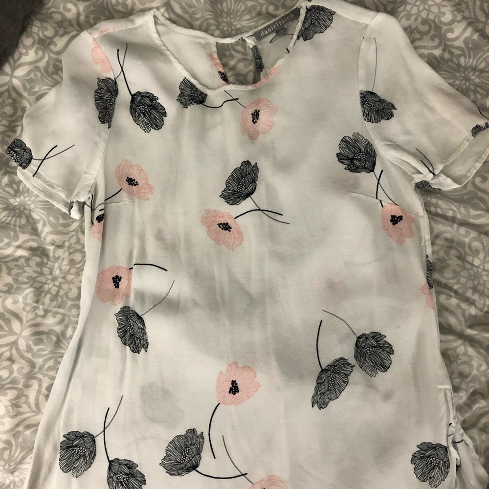 White blouse with pink and black floral design